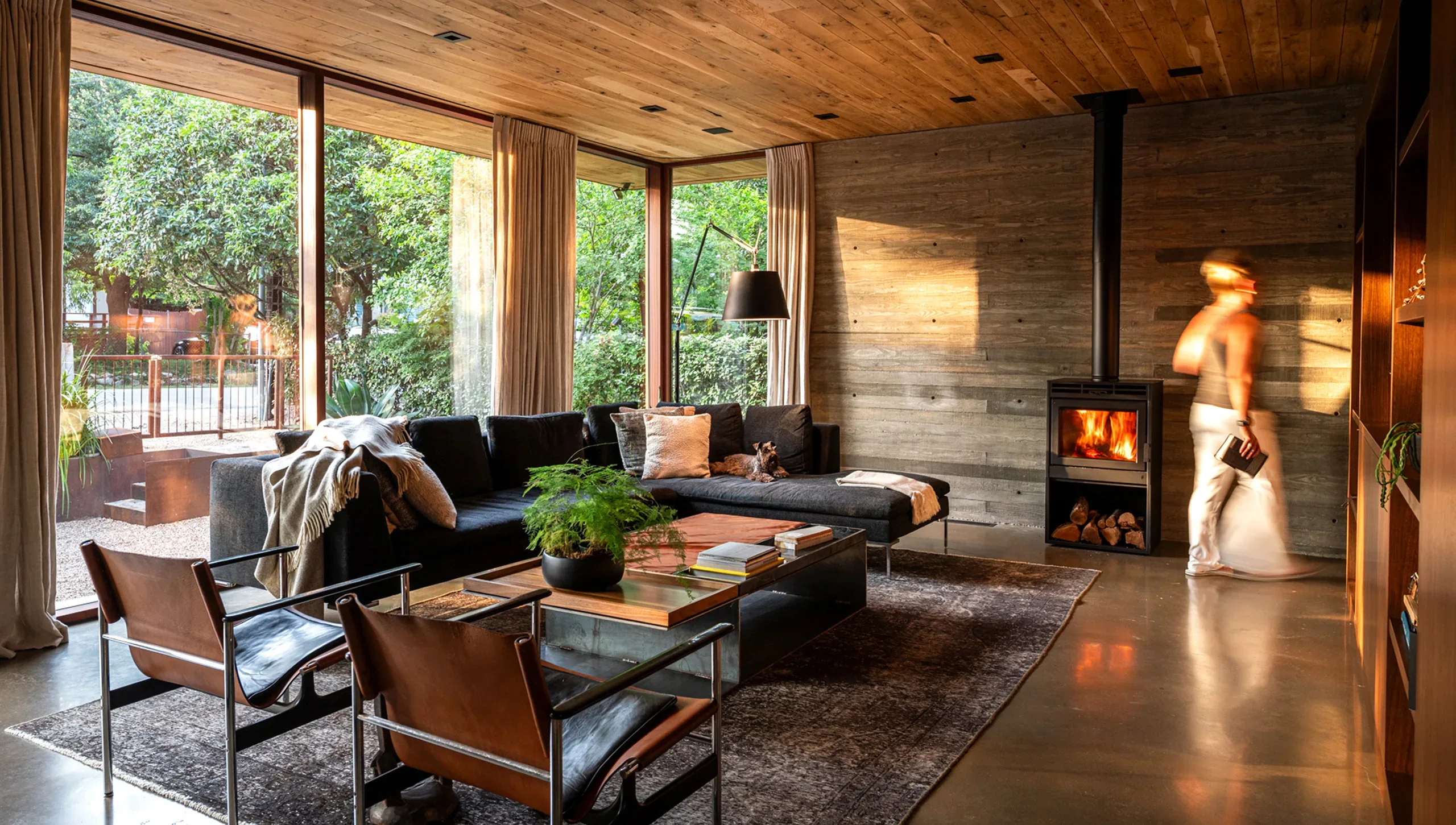 A living room with a wood burning stove.